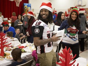 Jamill Smith is enjoying his time in Ottawa. Recently he took time to sign autographs and hand out team towels to Grade One and Two students enjoying a Christmas lunch at St. Elizabeth School.