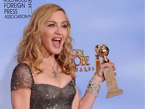 Madonna, a 1997 Golden Globe winner, with her trophy.