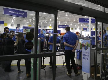 Staff meeting just before doors opened for the Boxing Day sale at Best Buy on Merivale Road, Dec. 26, 2014.