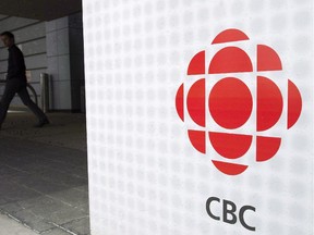 A man leaves the CBC building in Toronto, April 4, 2012.