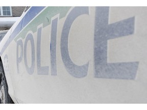 A police cruiser sits outside the house of Sen. Patrick Brazeau in Gatineau, Que., Thursday, Feb.7, 2013. The controversial and outspoken Brazeau was kicked out of the Conservative caucus Thursday amid media reports that he'd been arrested following a domestic disturbance at his home.