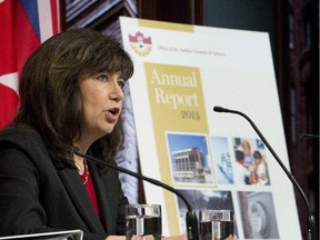 Auditor General Bonnie Lysyk delivers her 2014 report during a news conference in Toronto on Tuesday.