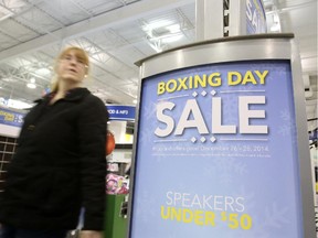A Boxing Day shopper at Best Buy on Merivale Road, Dec. 26, 2014.