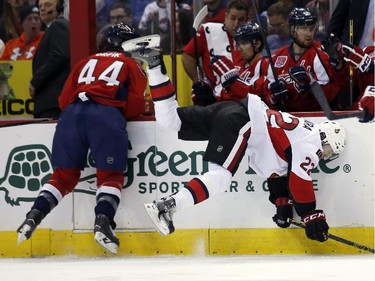 Washington Capitals defenseman Brooks Orpik (44) boards Ottawa Senators right wing Erik Condra (22) in the second period.