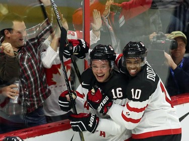 Team Canada's Max Domi (16) celebrates his goal against Sweden with teammate Anthony Duclair (10) during first period exhibition hockey action in preparation for the upcoming IIHF World Junior Championships in Ottawa Sunday, December 21, 2014.