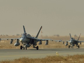 Royal Canadian Air Force CF-18 fighter jets taxi on the runway in Kuwait during Operation IMPACT on November 13, 2014. 

Photo: Canadian Forces Combat Camera, DND

Des chasseurs CF18 de l’Aviation royale canadienne circulent sur la piste, au Koweït, au cours de l’opération IMPACT, le 13 novembre 2014. 

Photo : Caméra de combat des Forces canadiennes, MDN 
IS2014-5028-02