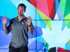 Chef de mission Jean-Luc Brassard talks on stage as the Canadian Olympic Committee 2016 meets with athletes  about preparations for the Rio 2016 Summer Games.