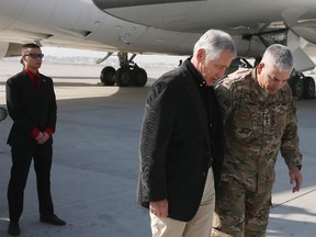 U.S. Secretary of Defense Chuck Hagel is greeted by Gen. John F. Campbell (R) after arriving on Saturday, Dec. 6, 2013 in Kabul, Afghanistan. Speaking in Afghanistan Saturday, Dec. 6, 2014, Secretary Hagel said American photojournalist Luke Somers "and a second non-U.S. citizen hostage were murdered" by al-Qaida militants during a failed U.S. rescue attempt.