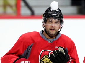 Clarke MacArthur catches a snowball tossed to him as the Ottawa Senators practice at the Canadian Tire Centre. Assignment - 119031 Photo taken at 11:31 on November 19. (Wayne Cuddington/ Ottawa Citizen)
