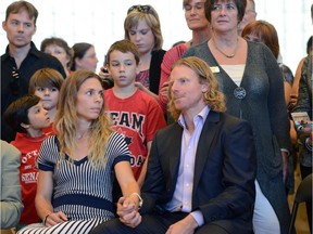 Daniel Alfredsson's place in the Ottawa community marks him as forever in our hearts. Here he holds hands with his wife Bibi at a press conference.