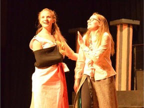 Desdemona played by Maeve Stinson-O'Gorma, left, and Constance played by Eden Taylor-Tapp in a scene from during Cairine Wilson Secondary School's Cappies production of Goodnight Desdemona (Good Morning Juliet).