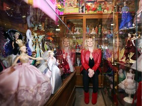 Elizabeth Kondruss looks on at some of her tens of thousands of Barbie's onTuesday, December 30, 2014. (Cole Burston/Ottawa Citizen)