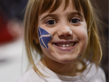 Emma (5) smiles for the camera during the TD Hogmanay 2014 celebration by The Scottish Society of Ottawa held at Aberdeen Pavilion on Wednesday, Dec. 31, 2014.