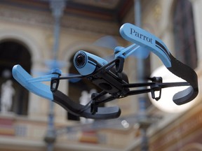 FILE - In this Nov. 7, 2014 file photo, a drone flies during a presentation to the press in Paris, France, Friday, Nov. 7, 2014.   Alarmed by increasing encounters between small drones and manned aircraft, the drone industry is teaming up with the government and model aircraft hobbyists to launch a safety campaign.