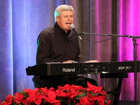 Prime Minister Stephen Harper performs at the Conservative caucus Christmas party, Tuesday December 9, 2014.