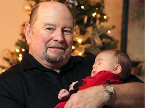 After recent brain stimulation surgery, Herb Durand received the best Christmas present ever — being able to hold his grandson, Warren.