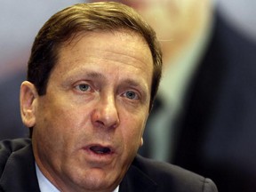 Israeli chairman of the Labor Party and leader of the opposition Isaac Herzog speaks to the press at the Knesset (Israel's Parliament) on December 3, 2014 in Jerusalem. I