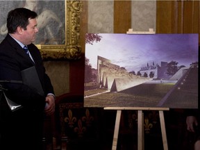 Employment and Social Development Minister Jason Kenney examines a drawing in Ottawa, Thursday December 11, 2014 of the National Memorial to Victims of Communism which will be situated near the Supreme Court of Canada.