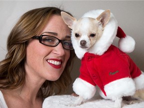 Jennifer Graham, owner of the Barking Teacup, was inspired to start an online clothing and accessories business catering to small pets by her chihuahua Ms. Moneypenny. Here she models a fleece Santa Coat by Puppia, which is available for $38.95.