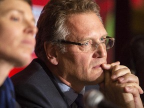 Jerome Valcke, secretary general of FIFA , right, looks on during a press conference at The Westin Friday December 5, 2014 to set up the official draw of the 2015 FIFA Women's World Cup of soccer.