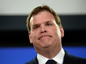 Minister of Foreign affairs John Baird holds a press conference at the National Press Theatre in Ottawa on Friday, Dec. 19, 2014.