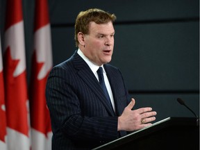 Minister of Foreign affairs John Baird holds a press conference at the National Press Theatre in Ottawa on Friday, Dec. 19, 2014.