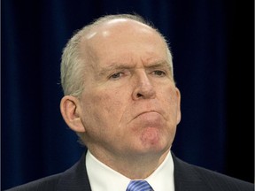CIA Director John Brennan pauses during a news conference at CIA headquarters in Langley, Va., Thursday, Dec. 11, 2014. Brennan defending his agency from accusations in a Senate report that it used inhumane interrogation techniques against terrorist suspect with no security benefits to the nation.