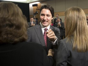 Liberal leader Justin Trudeau welcomes Liberal nominee's during an event in Ottawa, Wednesday December 10, 2014.