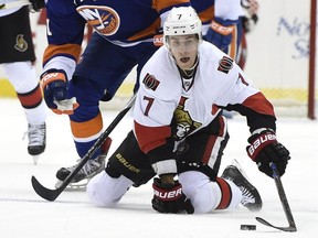 Ottawa Senators center Kyle Turris (7) dives to the ice to control the puck against New York Islanders right wing Kyle Okposo (21) in the first period.