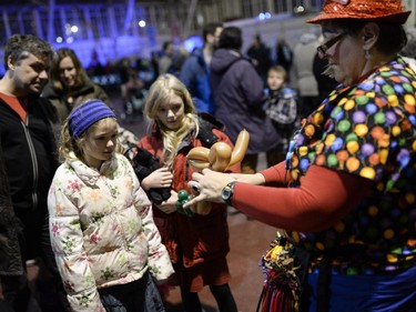 (L-R) Michelle and Natalie waits for a balloon animal during the TD Hogmanay 2014 celebration by The Scottish Society of Ottawa held at Aberdeen Pavilion on Wednesday, Dec. 31, 2014.
