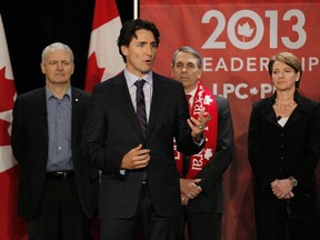 David Bertschi (wearing a red Liberal scarf), stands behind then-Liberal leadership candidate Justin Trudeau, and alongside Marc Garneau and Martha Hall Findlay in Winnipeg in February, 2013.