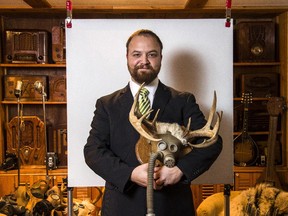 Marc Adornato with a mask-and-antlers assemblage in February 2014.