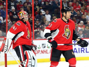 Marc Methot, right, and Craig Anderson of the Ottawa Senators in action against the New York Islanders during second period action.