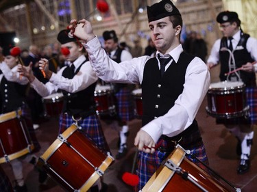 Members of the Glengarry Pipe Band from Maxville perform as they enter the stage during the TD Hogmanay 2014 celebration .