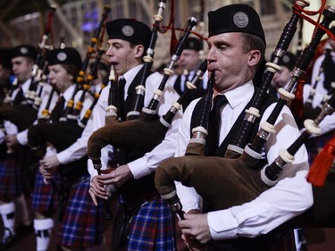 Members of the Glengarry Pipe Band from Maxville perform  as they enter the stage during the TD Hogmanay 2014 celebration by The Scottish Society of Ottawa held at Aberdeen Pavilion on Wednesday, Dec. 31, 2014.
