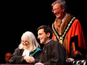 Michael Qaqishis sworn in as Councillor for Ward 22 Gloucester-South Nepean by Justice Louise Logue  at Centrepointe Theatre and witnessed by Ottawa Mayor Jim Watson, December 01, 2014.