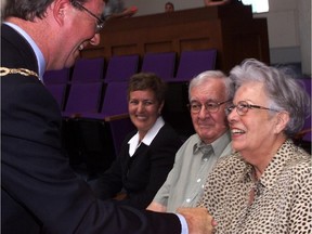Ottawa Mayor Jim Watson greets his parents, Frances and Bev, with his sister Jayne Watson looking on in a 2000 file photo.