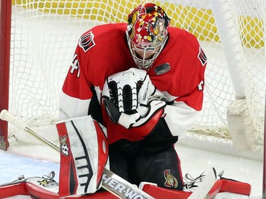 Ottawa Senators goaltender Craig Anderson (41) makes a save on a Buffalo Sabres shot during first period NHL hockey action.