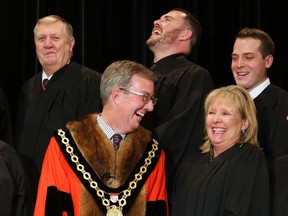 Ottawa Mayor Jim Watson shares a laugh with Councillor Diane Deans prior to be being sworn in at a ceremony held at Centrepointe Theatre in Ottawa, December 01, 2014.  (Jean Levac/ Ottawa Citizen) ORG XMIT: 1202 newcouncil