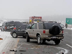 Drivers wait in the cold after this 70-car pileup on Highway 416 on Dec. 16, 2009.