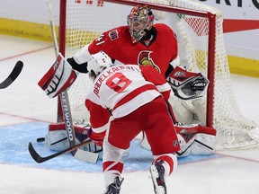 Ottawa Senators goaltender Craig Anderson makes a save on the Detroit Red Wings' Justin Abdelkader during the first period.