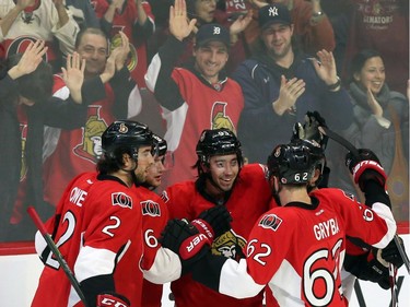 Ottawa Senators' Mika Zibanejad (93)celebrates his goal against the Vancouver Canucks with teammates Jared Cowen (2) Bobby Ryan (6) and Eric Gryba (62) during NHL second period action in Ottawa Sunday, December 7, 2014.