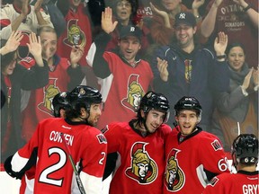 The Ottawa Senators' Mika Zibanejad (93) celebrates his goal against the Vancouver Canucks with teammates during the second period in Ottawa Sunday, Dec. 7, 2014.