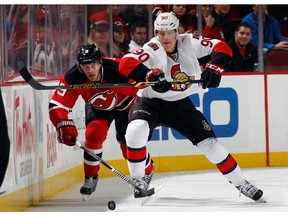 Alex Chiasson, seen here competing with  Martin Havlat of the New Jersey Devils, is signalling that he's happy to stay long term in Ottawa.