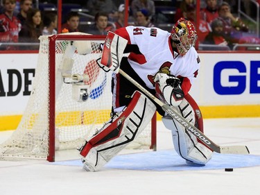 Goalie Craig Anderson #41 of the Ottawa Senators passes the puck during the first period.