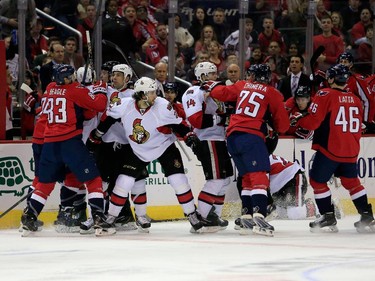 Members of the Washington Capitals and Ottawa Senators are separated during the second period.