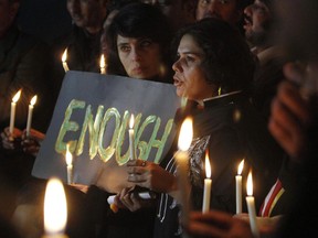 Pakistani civil society members take part in a candle light vigil for the victims of a school attacked by the Taliban in Peshawar, Tuesday, Dec. 16, 2014 in Islamabad, Pakistan.