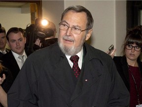 Reporters follow MP Peter Goldring after a news conference on March 27, 2014 in Ottawa. Goldring recently apologized after sending out a statement claiming he wore a body camera to protect against false allegations.