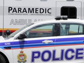 Police cruiser and ambulance outside Civic Campus of the Ottawa Hospital in Ottawa, Wednesday, June 18, 2014. Several police officers and paramedics were injured, two seriously, during a joint training incident in Kanata earlier today. Mike Carroccetto / Ottawa Citizen