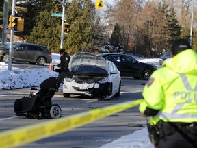 Police investigate a serious crash involving a car and a motorized wheelchair on Woodroffe Ave. at Deerfox in Barrhaven Friday, December 19, 2014.